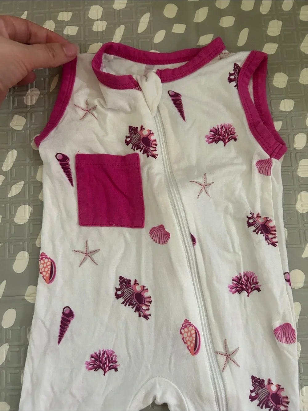 Kyte Baby Sleeveless White Baby Romper with Raspberry Shell Print